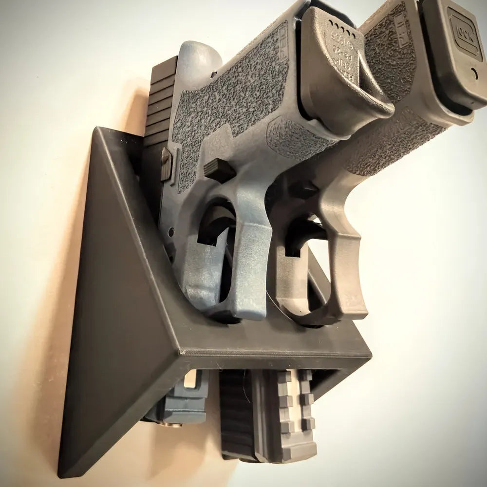 Black plastic pistol stand with punk-style design for displaying firearms