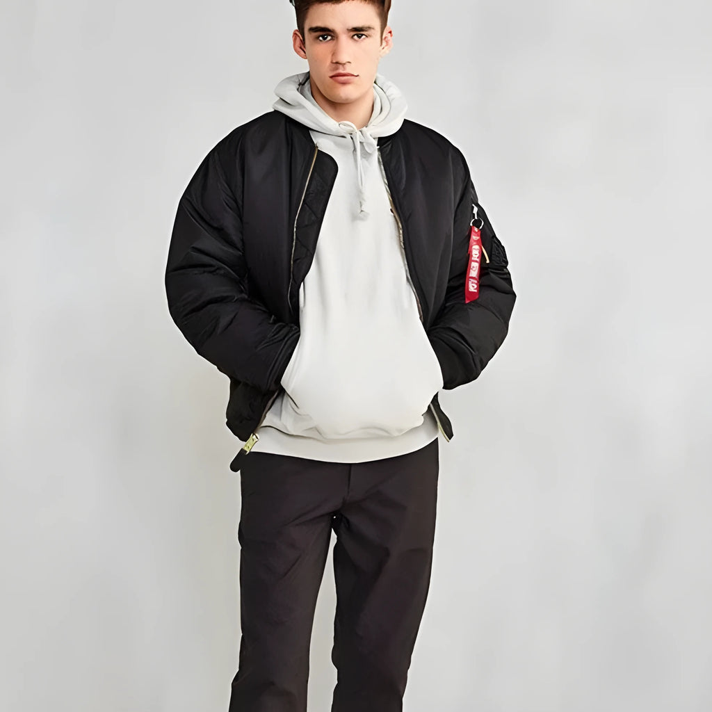 Men's loose-fit Army Green cotton-padded pilot jacket with wear-resistant nylon fabric on a hanger.