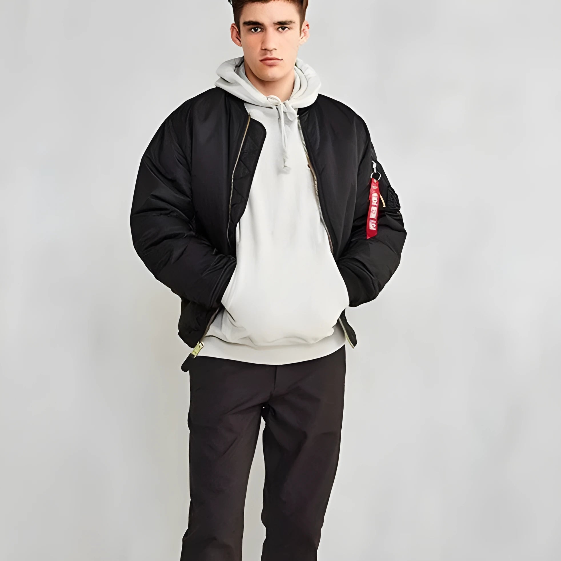 Men's loose-fit Army Green cotton-padded pilot jacket with wear-resistant nylon fabric on a hanger.