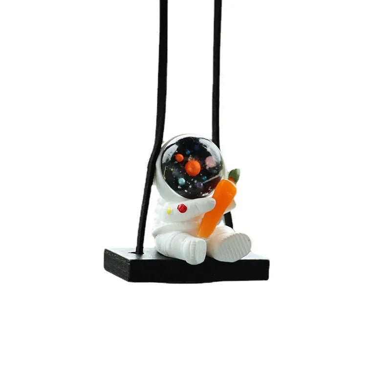 Cartoon astronaut resin pendant for car decoration, shown in various colour and style options.