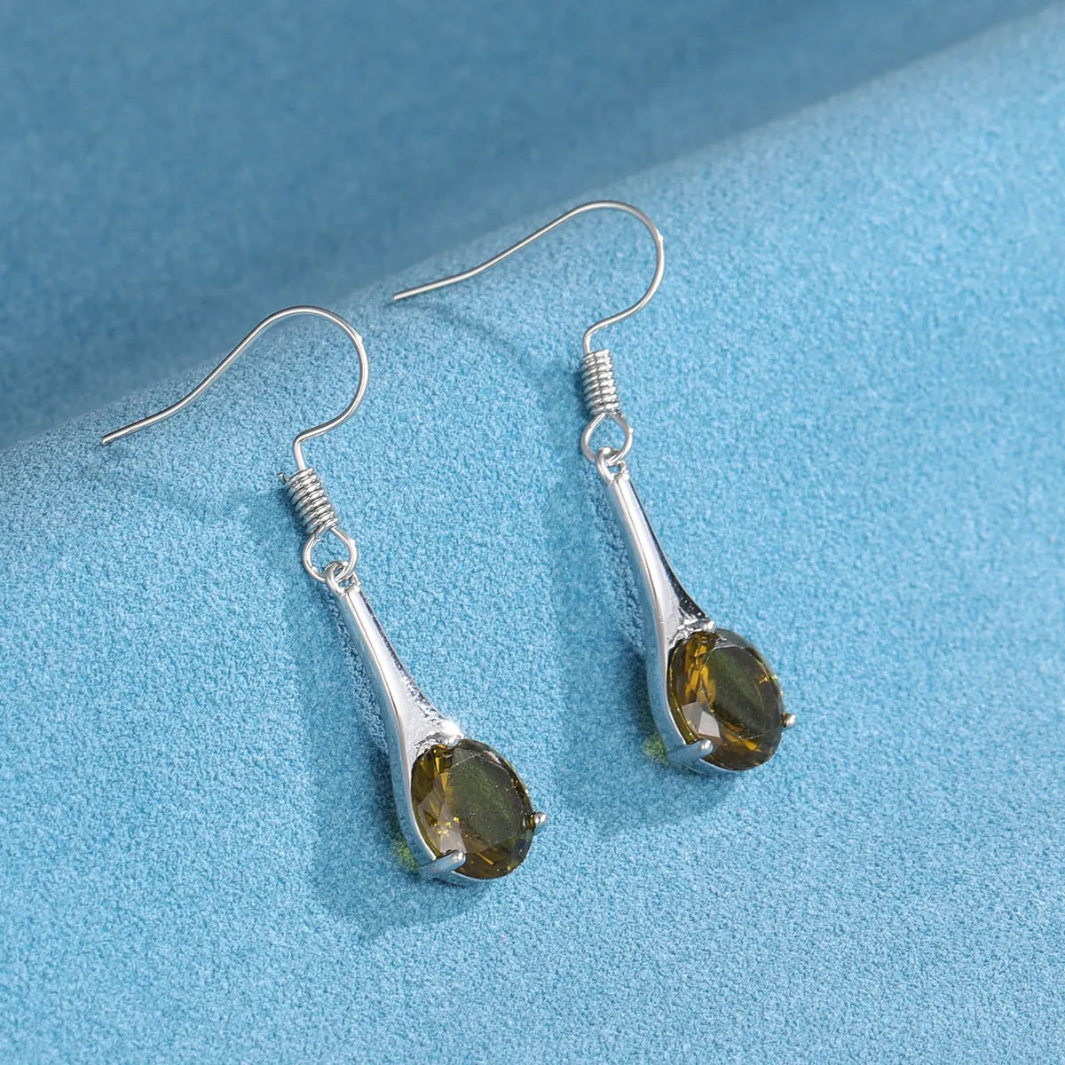 Olive green topaz drop earrings with water drop shape design and alloy construction