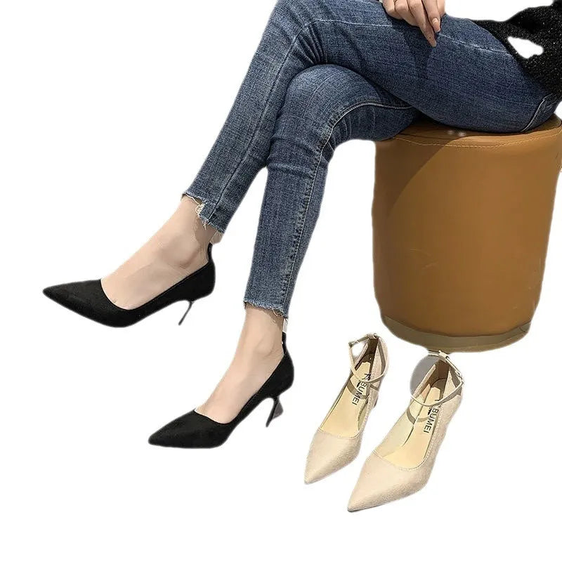 Women's black and creamy white stiletto heel pumps with buckle detail in 8cm and 5cm heel heights