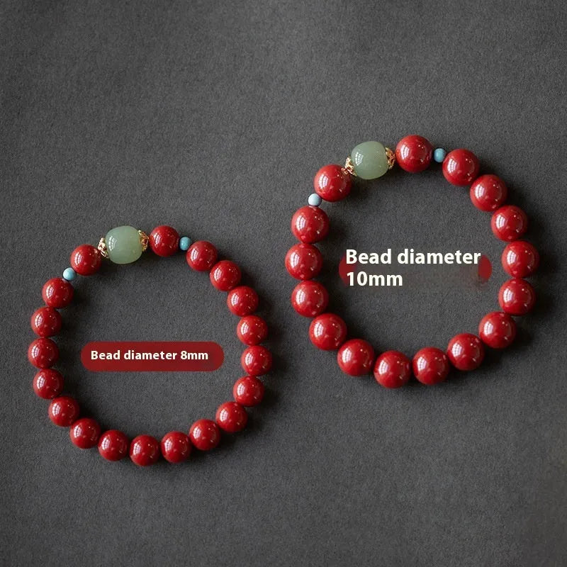 Geometric cinnabar and Hetian jade bead bracelet in purple gold sand colour on a wrist.