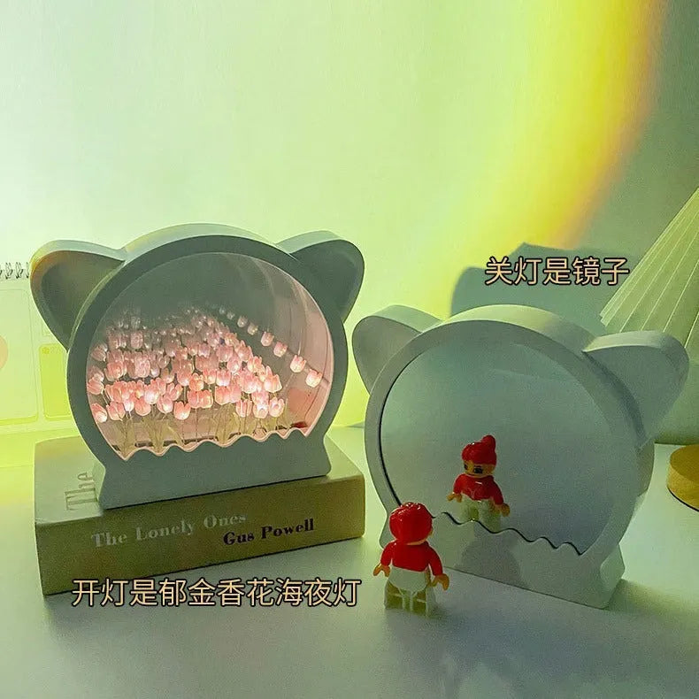 Handmade DIY cat head shaped night lamp with a sea of colourful tulip flowers, shown in pink.
