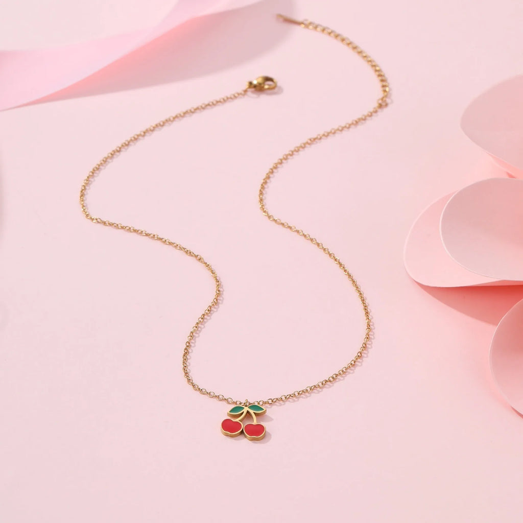 Stainless steel cherry jewellery set with necklace, bracelet, earrings, and ring in golden electroplated finish