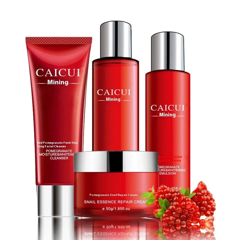 Pomegranate skincare set with four red bottles: cleanser, toner, lotion, and facial cream