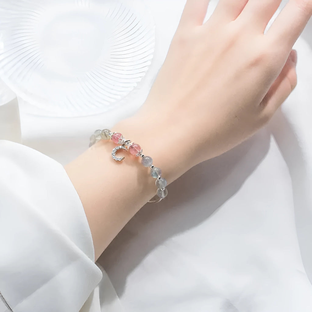 Adjustable moonstone bracelet with crescent moon charm and crystal on extension chain