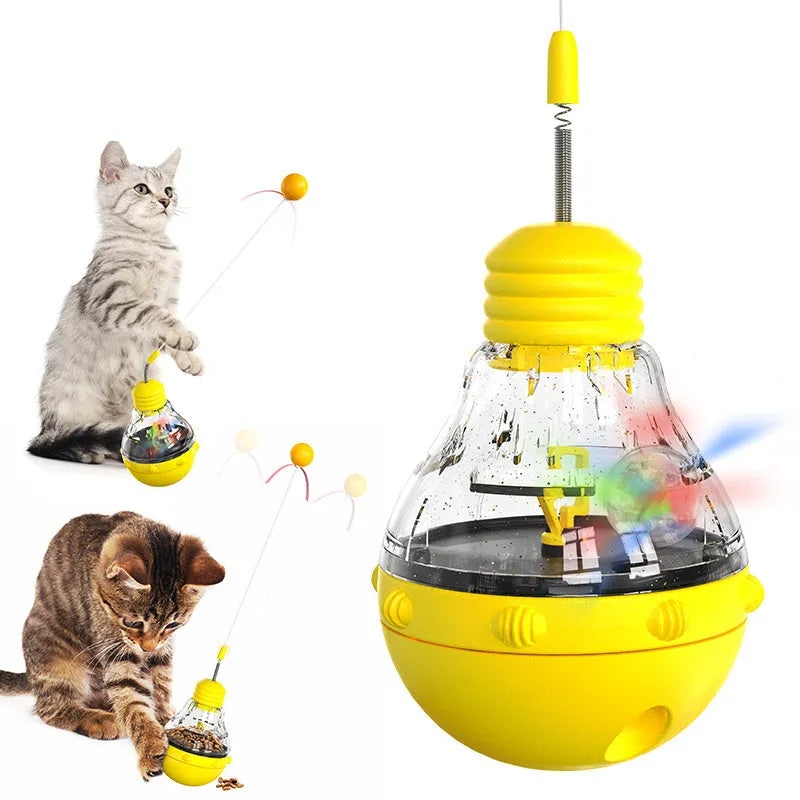 Pink, purple, and yellow tilting cat interactive toy with a bouncing teaser wand and built-in slow feeder.