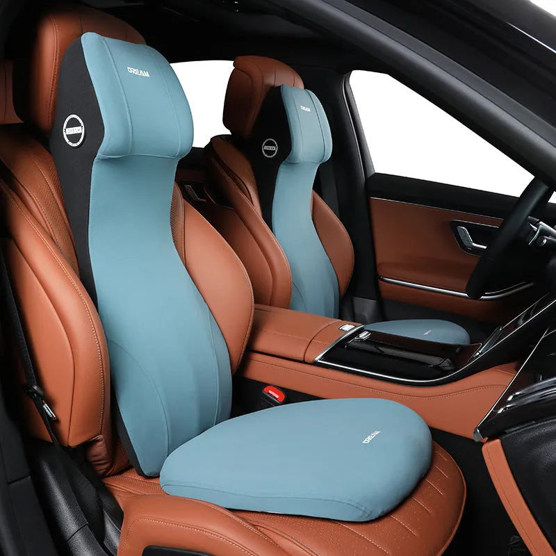 Black automotive memory foam waist cushion and headrest lumbar support pillow on a car seat.