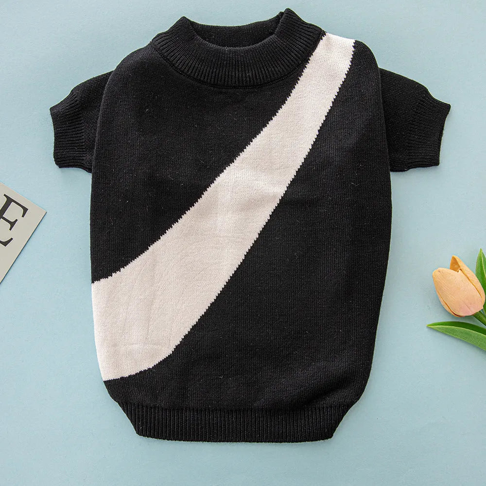 A small dog wearing a casual-style wool blend sweater in one of six available colours.
