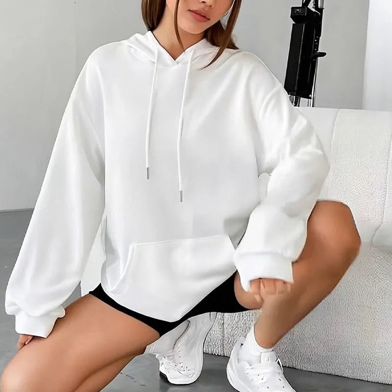 Women's loose grey drawstring hooded sweatshirt with side pockets, on a hanger.