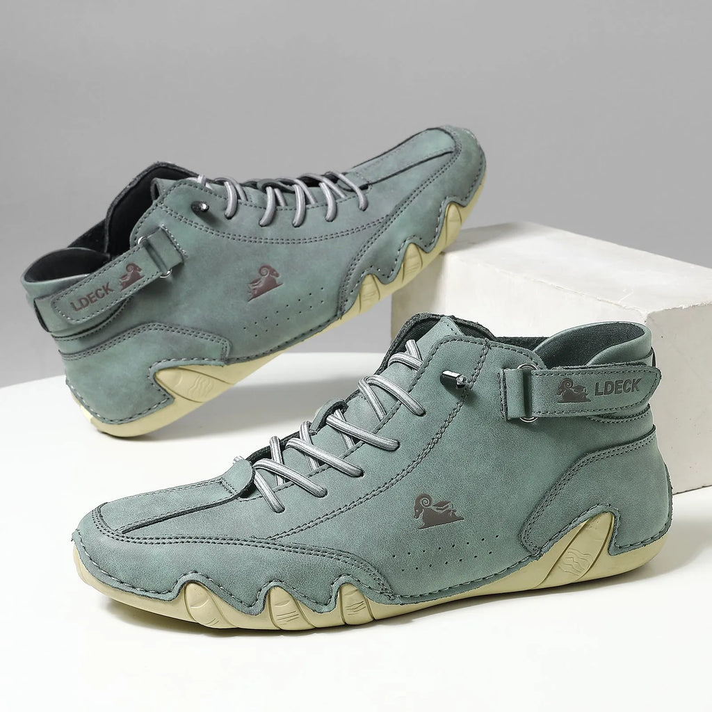 Men's khaki high top Octopus shoes with a round toe and rubber sole on a neutral background.