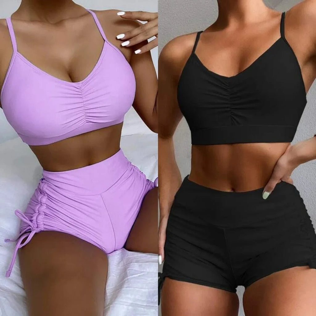 Women's black high waist split bikini swimsuit top and shorts laid flat.