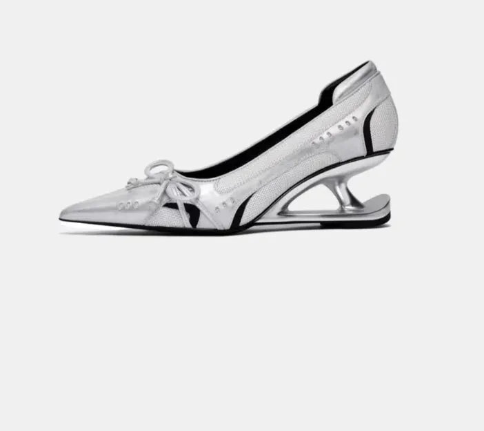 Women's black pointed toe Mary Jane shoes with shaped floating heel and microfiber leather upper on display