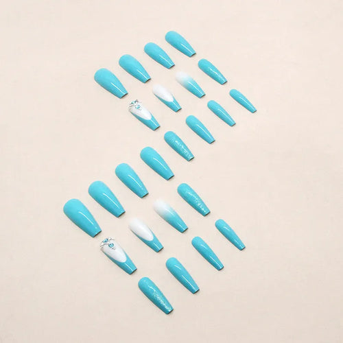 Long ballet shape false nails with solid blue colour and smart blue diamond design, shown with adhesive glue.