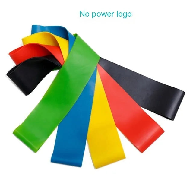 Set of five coloured yoga resistance bands with force markings arranged by thickness from thinnest to thickest