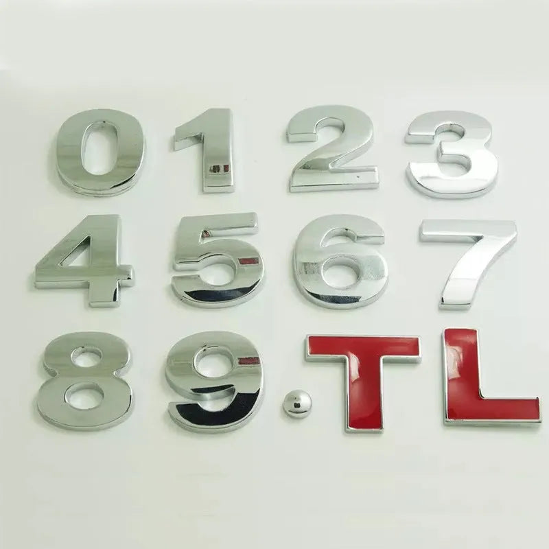 Close-up of a single 3D metal car letter sticker in zinc alloy on a vehicle bumper.