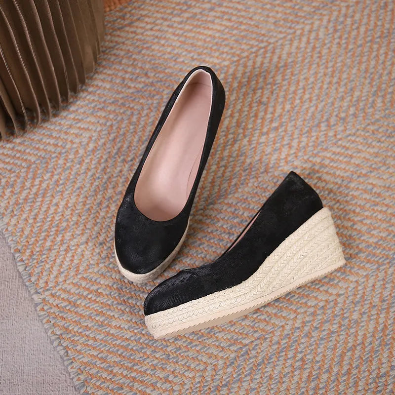 Women's apricot wedge heel pumps with rope-textured sole and shallow mouth opening on a white background.