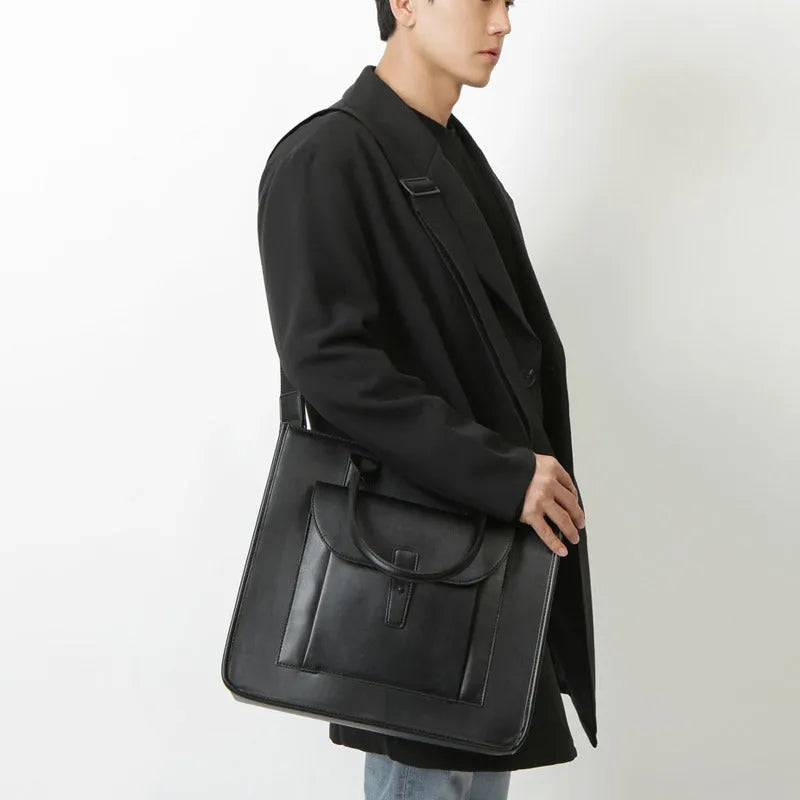 Men's PU leather shoulder messenger bag in solid black with vertical square shape