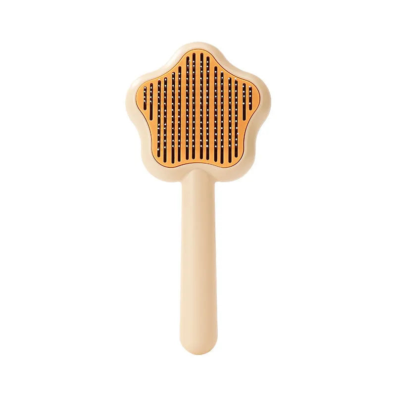 Green self-cleaning cat comb with stainless steel needles measuring 20 cm long