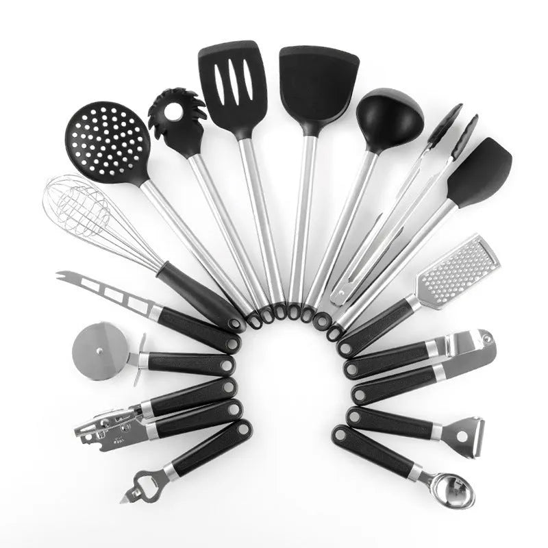 Black silicone and stainless steel kitchen spatula and spoon set, 16 pieces laid out.