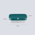 Modern minimalist green jewellery storage box with multi-layer compartments open on a dressing table.