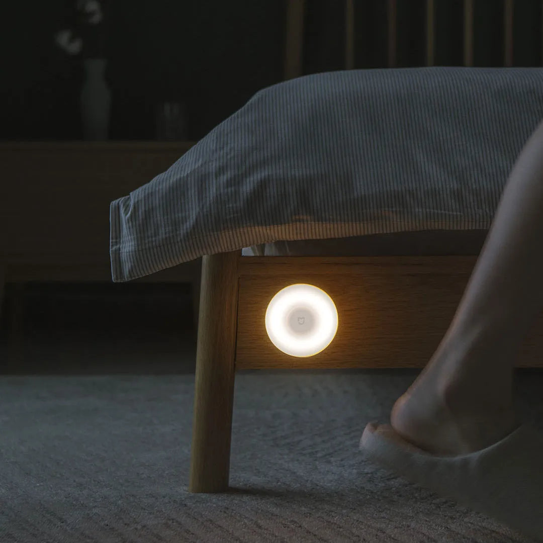 White modern bedside table lamp with Bluetooth and body induction sensor.