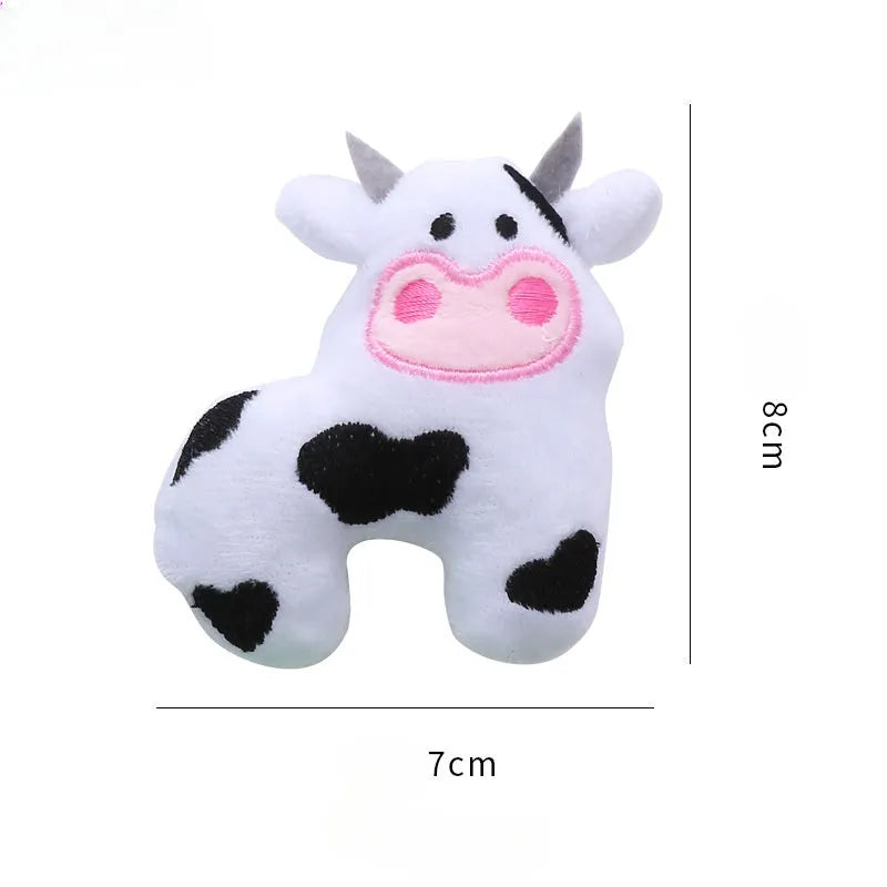 Plush cat toy in the shape of a cow and a parrot, designed for interactive play with catnip.