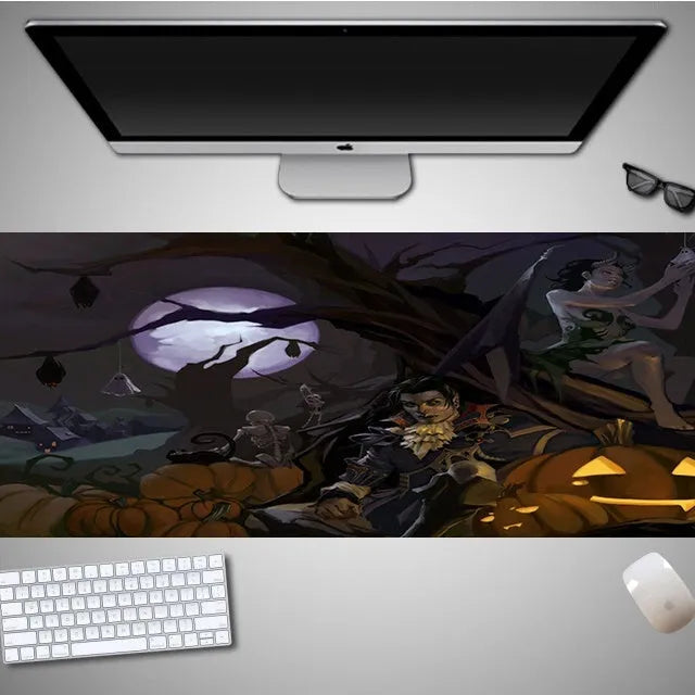 Oversized Halloween-themed gaming mouse pad with non-slip base on a desk.