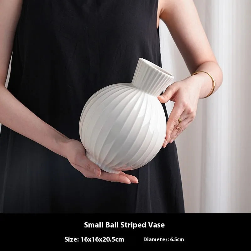 White American country style ball striped ceramic vase with orchid arrangement
