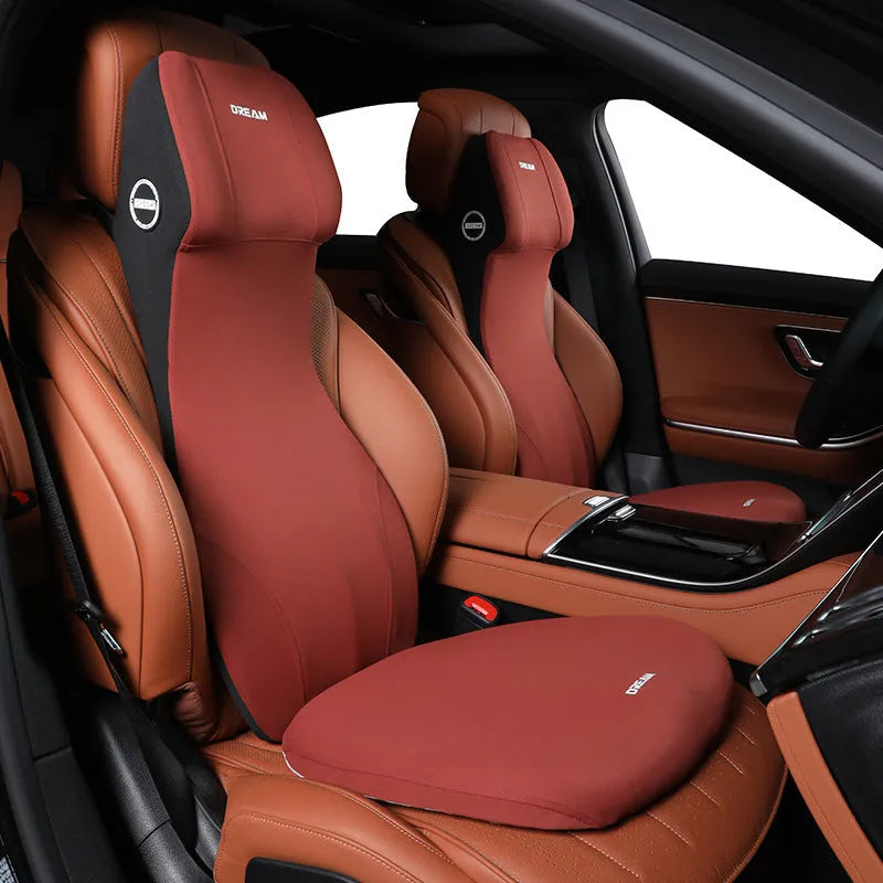 Black automotive memory foam waist cushion and headrest lumbar support pillow on a car seat.
