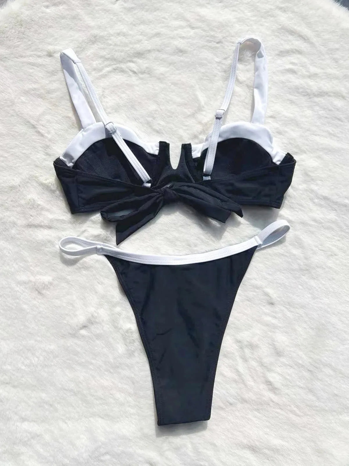 Black low waist women's bikini swimsuit with stitching detail and split briefs design