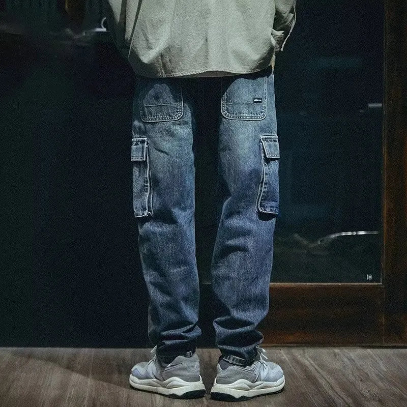 Blue men's loose fit straight-leg jeans with a zip fly on a mannequin