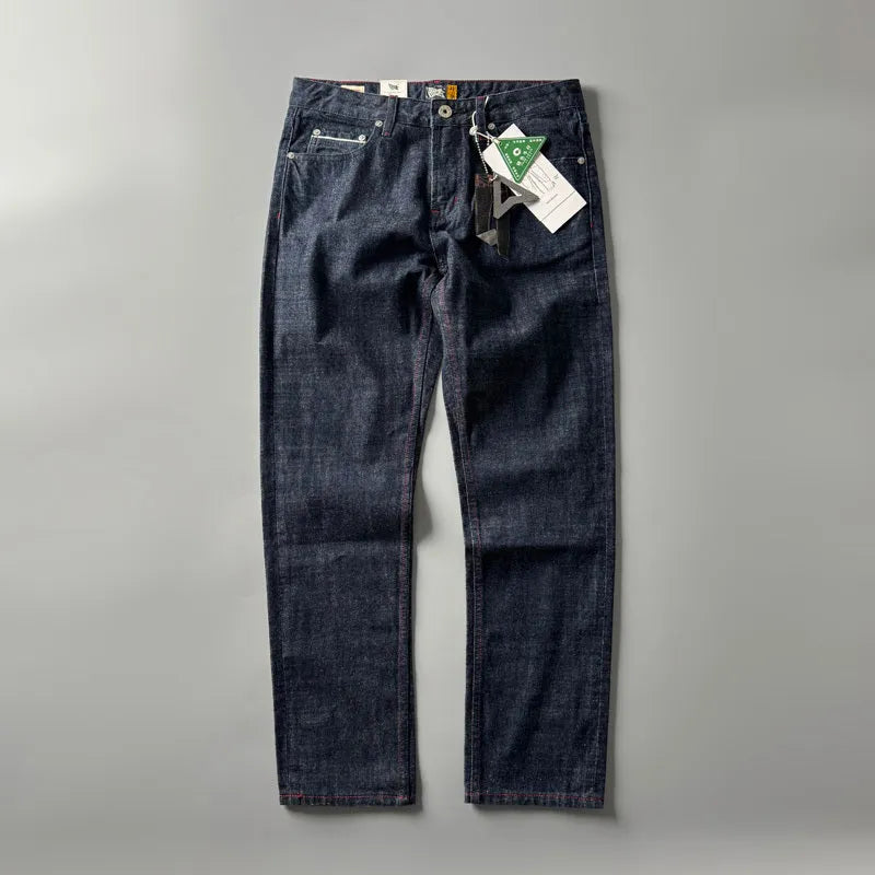 Men's primary blue straight-leg cotton denim trousers on a neutral background, showing mid-waist fit and trouser length.