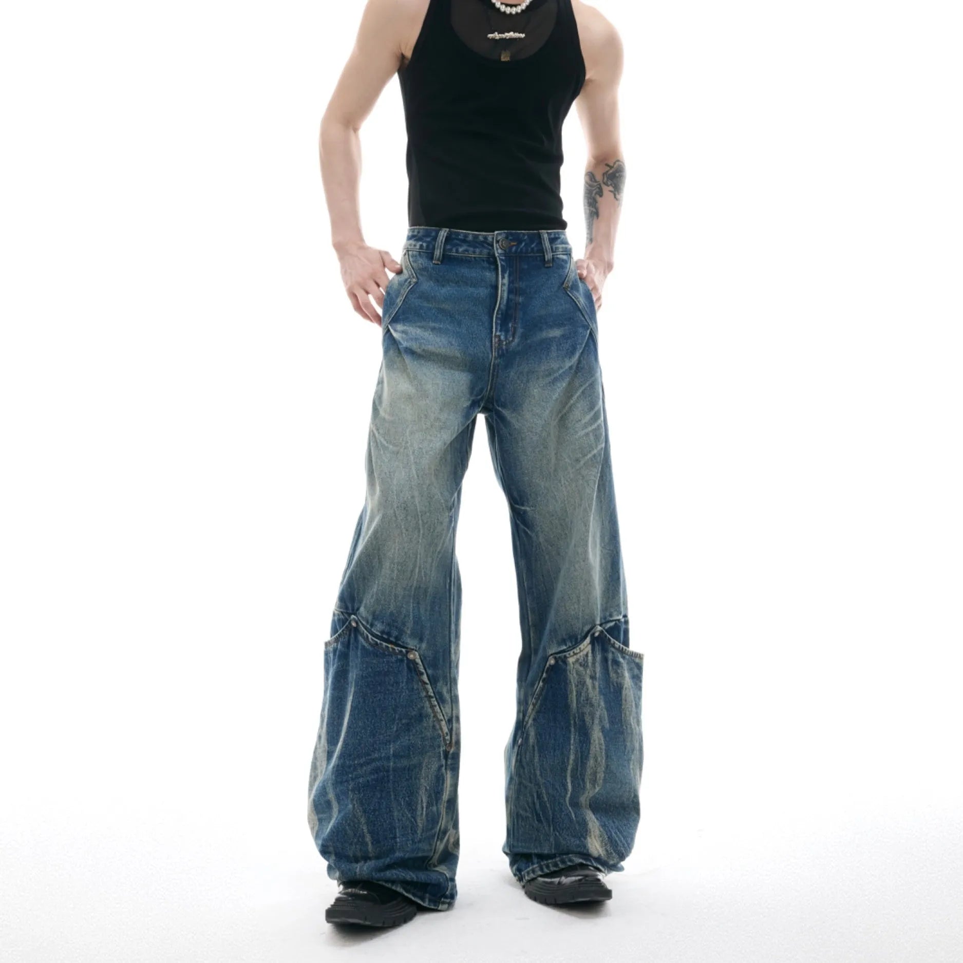 Men's verdant blue retro jeans with washed burst pattern and curved knife cut in loose fit