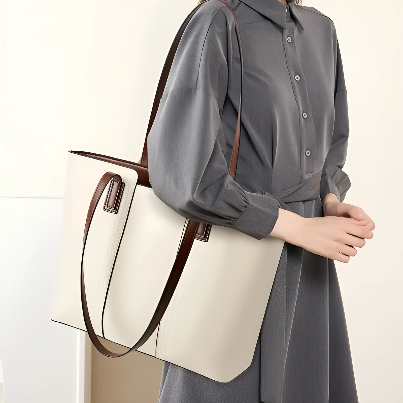 Black genuine leather women's shoulder bag showing multiple internal compartments and single strap