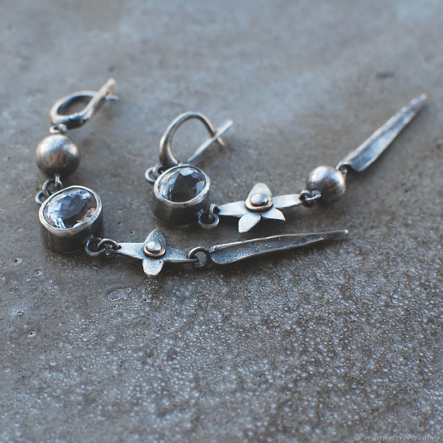 Geometric antique silver long drop earrings with rhinestones and a XINGX design motif.