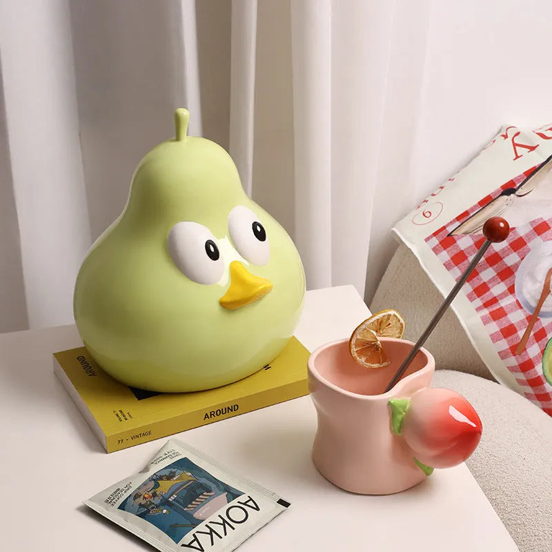 White ceramic pear-shaped tissue box with animal-themed design in green colour option