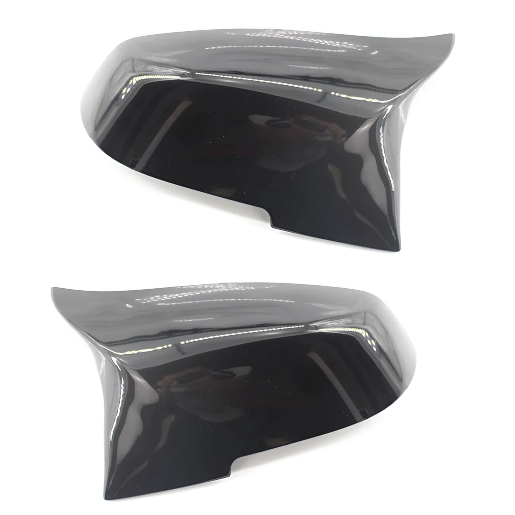 Pair of dark bright black BMW horn-style rear-view mirror replacement shells.