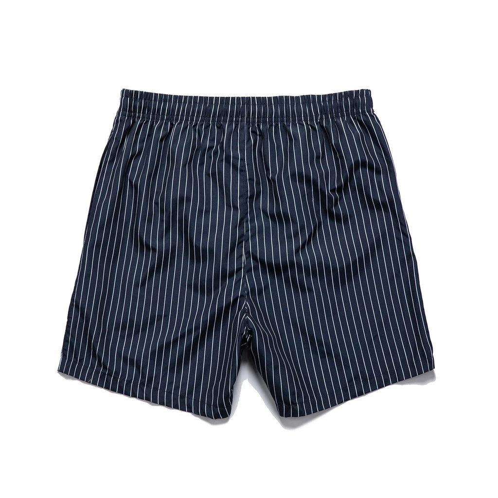 Polyester fibre striped beach shorts in navy blue with straight leg opening
