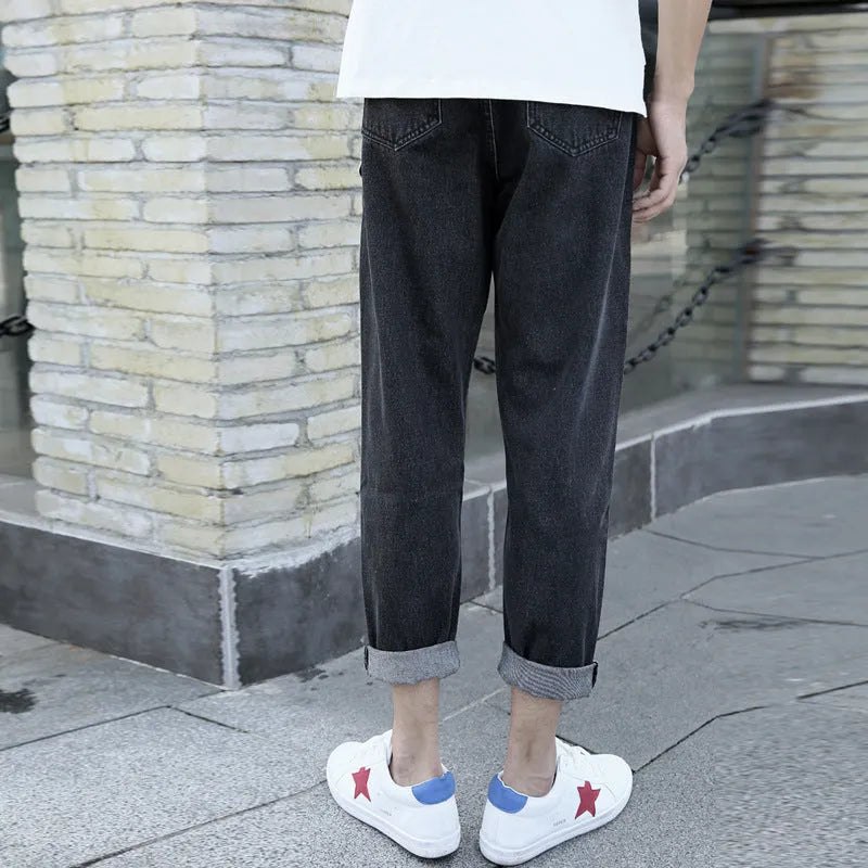 Men's straight leg cotton jeans in black and blue colours on a size chart background.