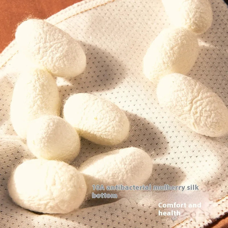 Men's solid colour ice silk briefs on a mid-waist mannequin, showing coffee, grey, white, and blue options.
