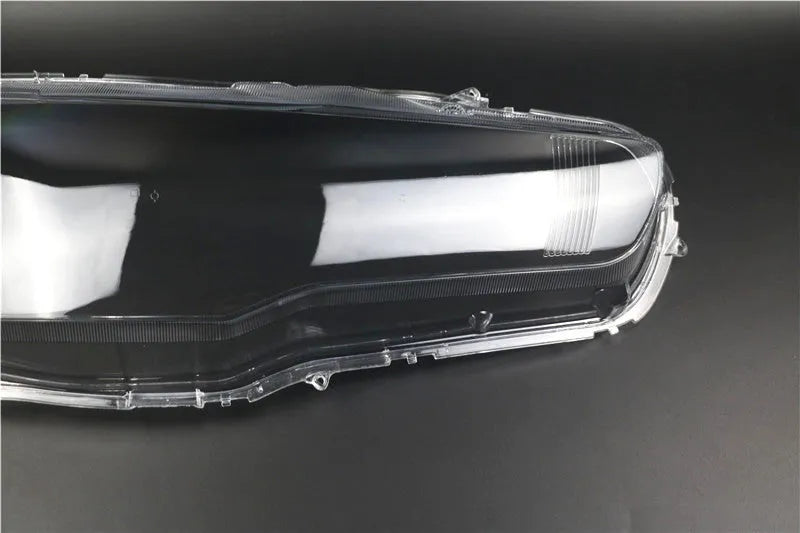 Transparent plastic headlight housing cover for vehicle lighting protection