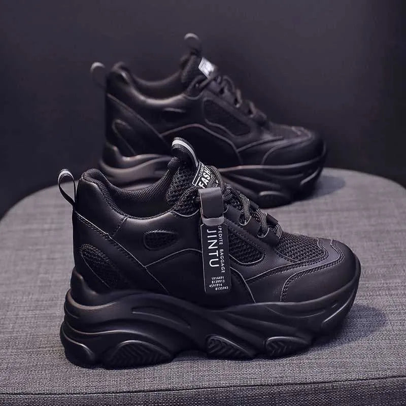 Women's black casual platform shoes with mesh upper and hollow-out design featuring toe holder