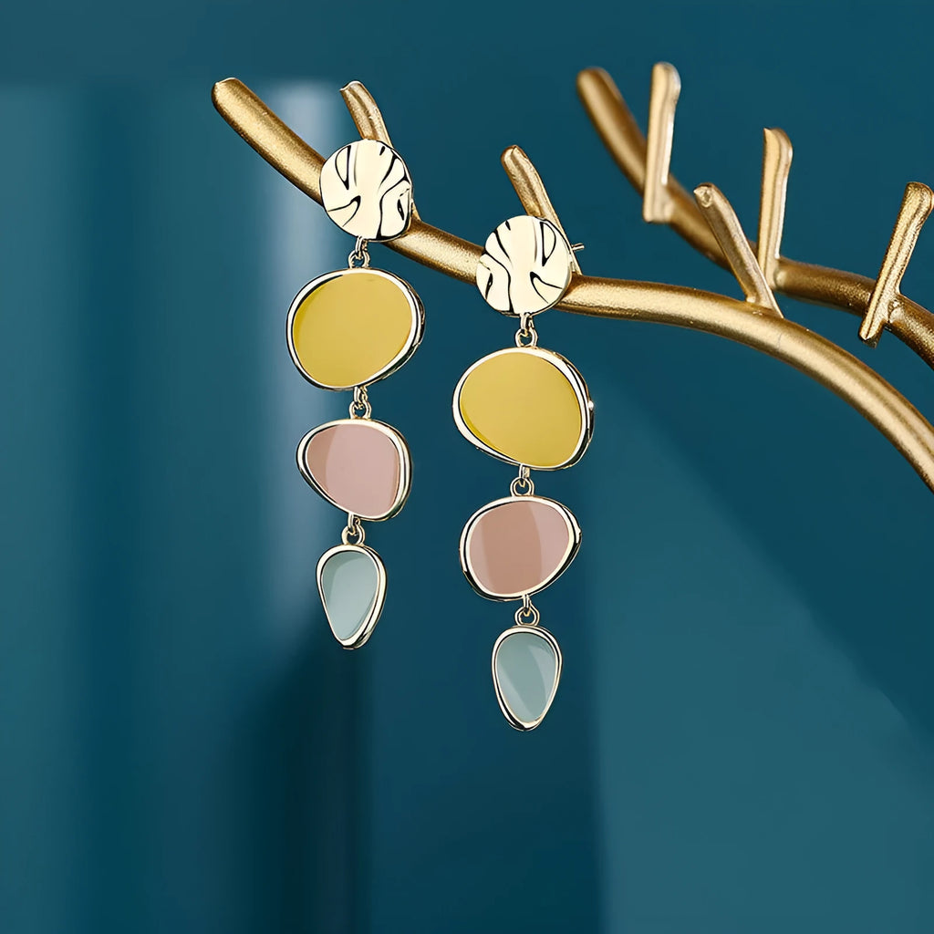 Morandi three-colour oil drip finish on a pair of simple alloy disc earrings with sterling silver posts.