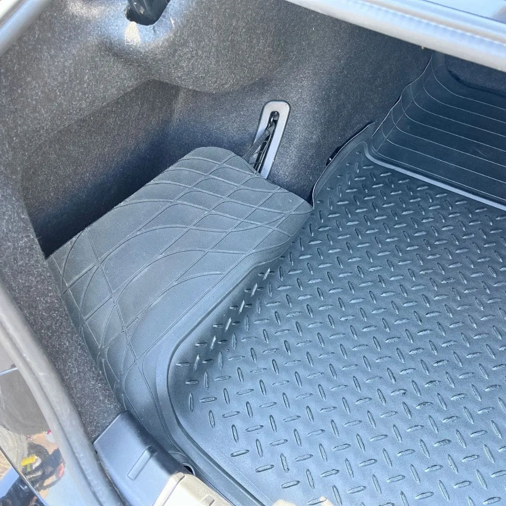 Black universal PVC waterproof car trunk mat in 80x120cm size laid flat on a clean car boot floor
