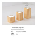 Modern solid wood surface mounted downlight in wood colour, shown in round and square designs for corridor or entrance ceilings.
