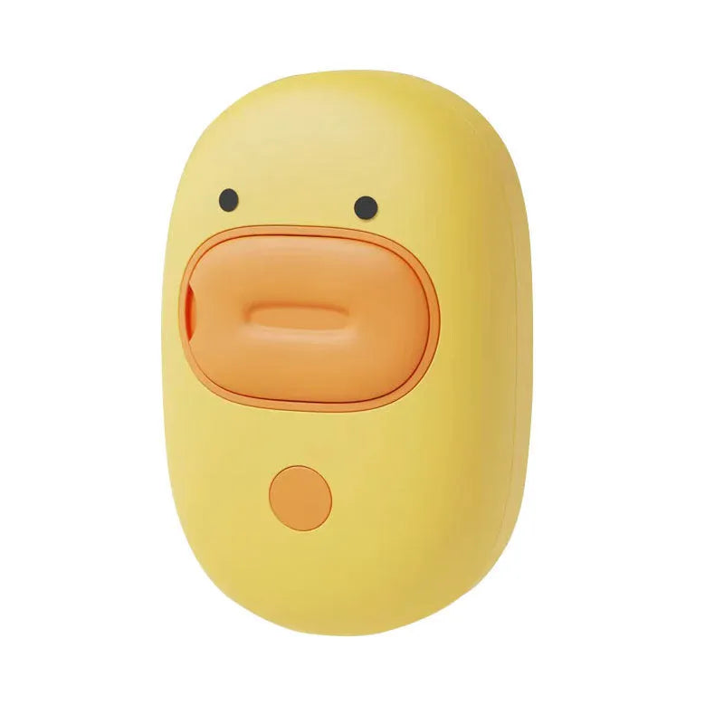 White and yellow rechargeable steam brush for grooming dogs and cats on a table.
