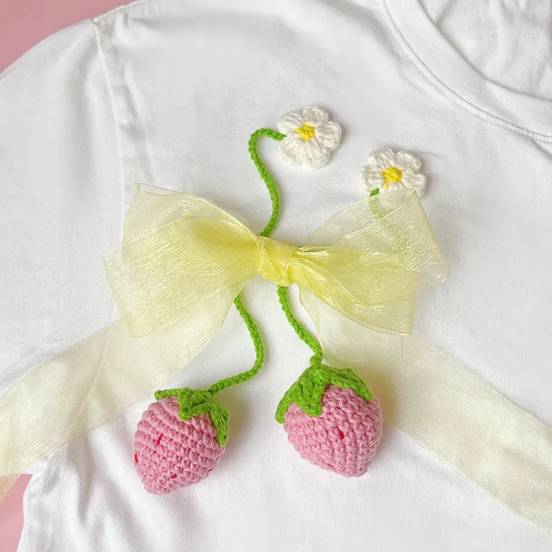 Wool crochet strawberry pendant necklace measuring 35cm with pink or red charm option