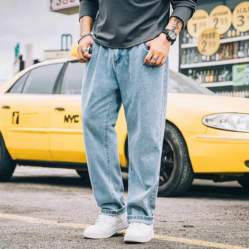 Men's loose straight jeans in cotton fabric showing mid waist fit and straight leg cut